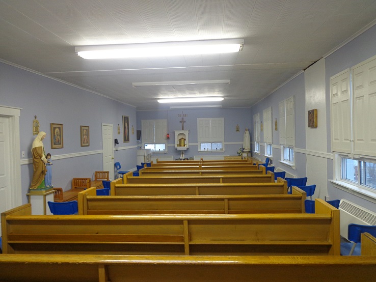 School chapel with pews and religious statues